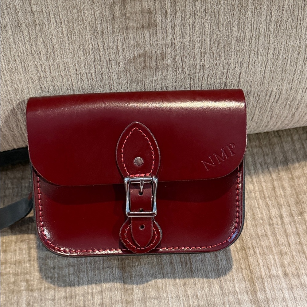 The leather satchel company, small maroon Crossbody bag, also known as a hipster